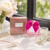 Pink perfume bottle paired with rose red bow perfume details Picture